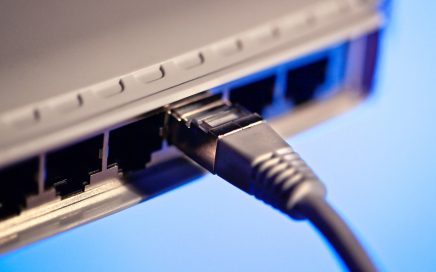 Close up photo of a Networking Switch and cable
